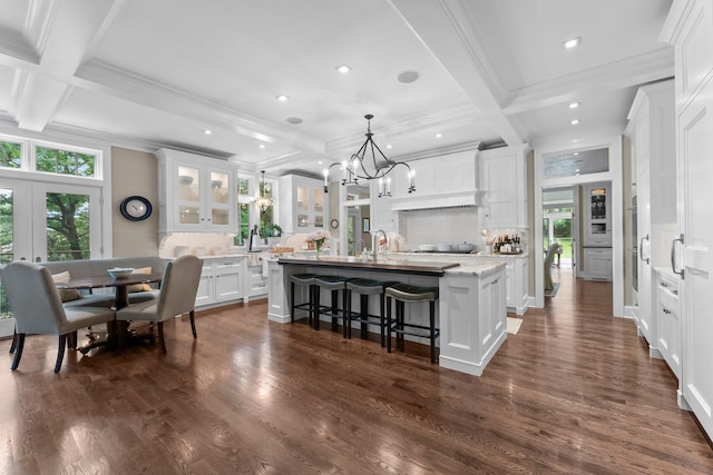 6601 Blackfoot Pass, Edina, MN 55439 - kitchen with a center island with sink, white cabinetry, and coffered ceiling