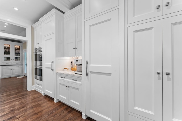 6601 Blackfoot Pass, Edina, MN 55439 - kitchen with recessed lighting, dark wood finished floors, double oven, white cabinets, and light stone countertops