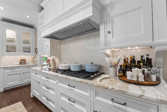 6601 Blackfoot Pass, Edina, MN 55439 - kitchen featuring white cabinets, dark wood finished floors, custom exhaust hood, and decorative backsplash