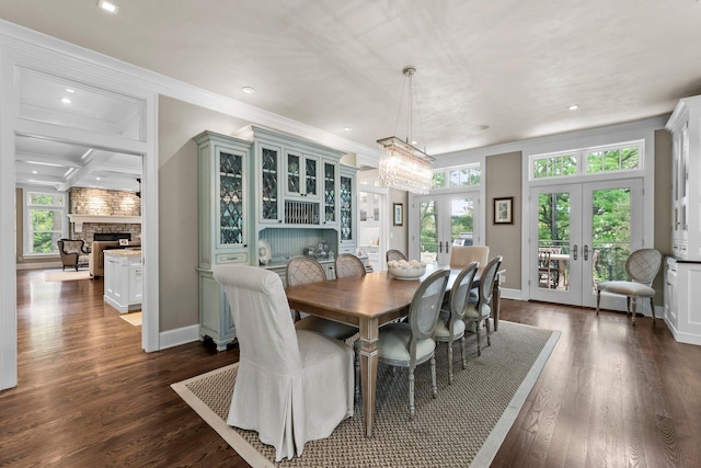 6601 Blackfoot Pass, Edina, MN 55439 - dining area with crown molding, french doors, dark wood finished floors, baseboards, and beamed ceiling