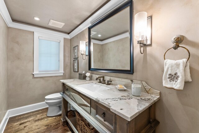 6601 Blackfoot Pass, Edina, MN 55439 - bathroom featuring toilet, vanity, wood finished floors, baseboards, and ornamental molding