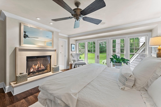 6601 Blackfoot Pass, Edina, MN 55439 - bedroom with a warm lit fireplace, crown molding, baseboards, wood finished floors, and access to exterior