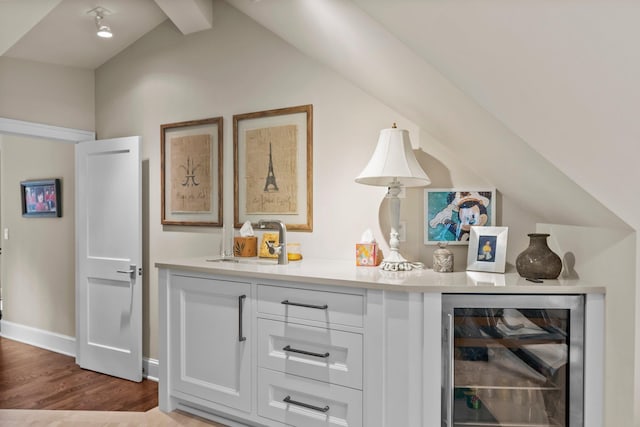 6601 Blackfoot Pass, Edina, MN 55439 - bar with lofted ceiling, wet bar, a sink, beverage cooler, and wood finished floors