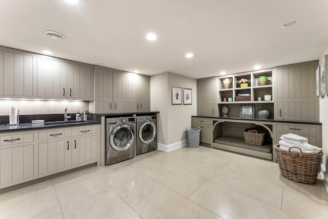 6601 Blackfoot Pass, Edina, MN 55439 - laundry area with a sink, separate washer and dryer, light tile patterned floors, cabinet space, and recessed lighting