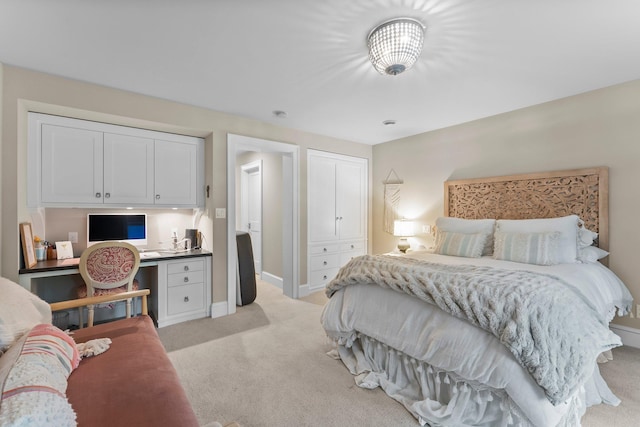 6601 Blackfoot Pass, Edina, MN 55439 - bedroom featuring baseboards, built in study area, a closet, and light carpet