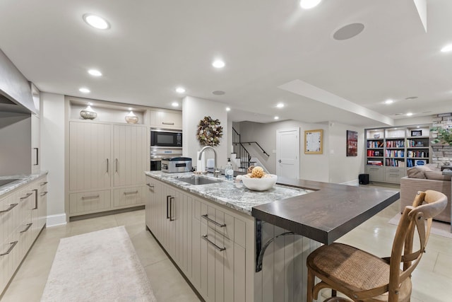 6601 Blackfoot Pass, Edina, MN 55439 - kitchen featuring a sink, a large island, open floor plan, built in microwave, and recessed lighting