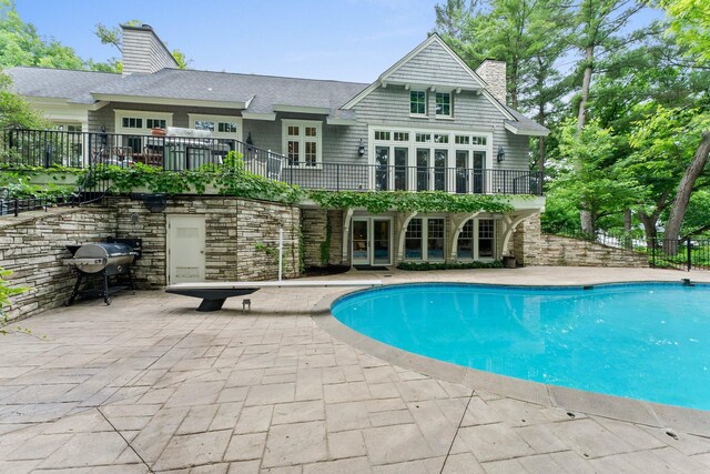 6601 Blackfoot Pass, Edina, MN 55439 - view of swimming pool featuring fence, french doors, grilling area, a fenced in pool, and a patio area