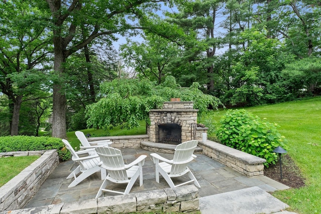 6601 Blackfoot Pass, Edina, MN 55439 - view of patio / terrace with an outdoor stone fireplace