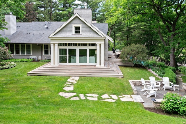 6601 Blackfoot Pass, Edina, MN 55439 - rear view of property with a wooden deck, a lawn, and a chimney