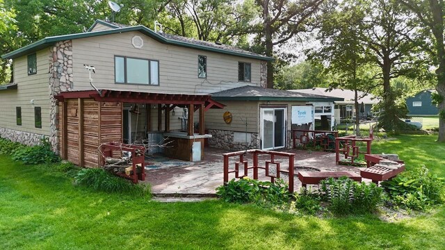 25234 Wall Lake Loop, Fergus Falls, MN 56537 - back of house featuring a wooden deck and a yard