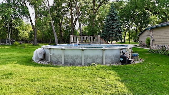25234 Wall Lake Loop, Fergus Falls, MN 56537 - outdoor pool featuring a yard, view of wooded area, and a wooden deck