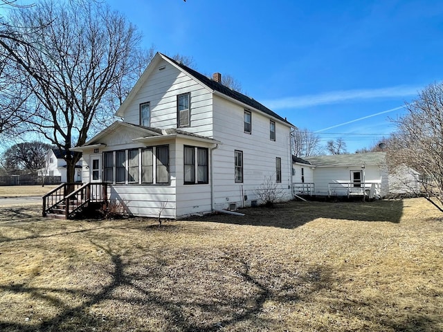 view of property exterior with a chimney