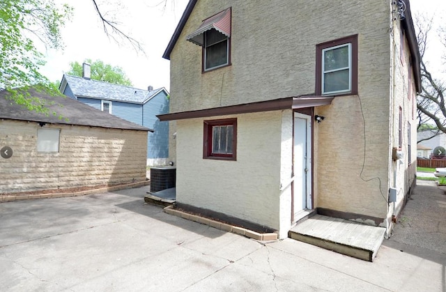 665 Bedford St, Saint Paul, MN 55130 - back of property with a patio area and stucco siding