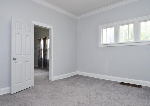 665 Bedford St, Saint Paul, MN 55130 - carpeted spare room featuring crown molding and baseboards