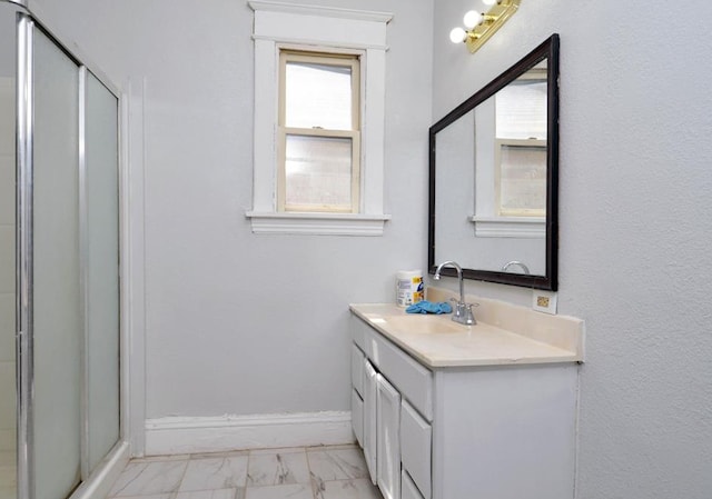 665 Bedford St, Saint Paul, MN 55130 - bathroom with marble look tiles, a stall shower, and vanity