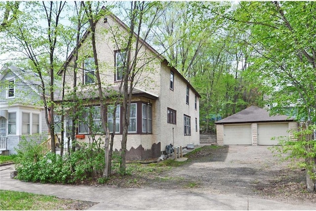 665 Bedford St, Saint Paul, MN 55130 - view of front of property featuring a garage and an outbuilding