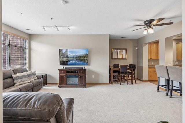 294 Spring St, Saint Paul, MN 55102 - living area featuring a ceiling fan and light colored carpet