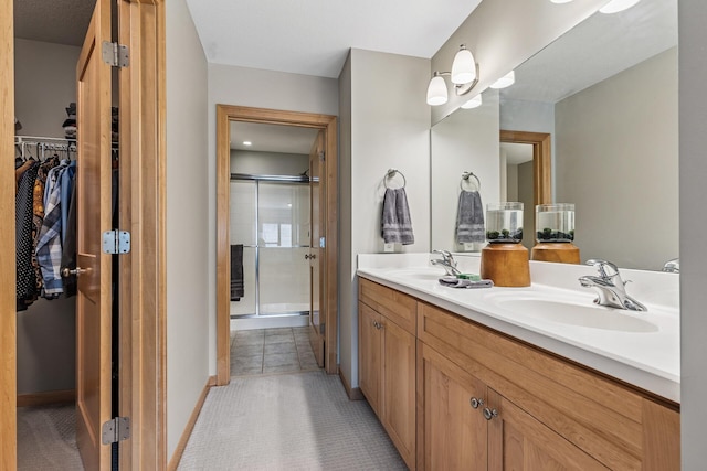 294 Spring St, Saint Paul, MN 55102 - full bathroom with a shower stall, double vanity, and a spacious closet