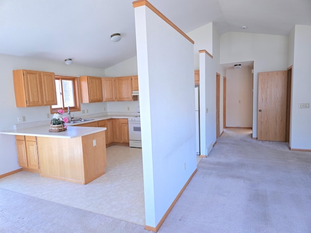 kitchen featuring a sink, light countertops, white range oven, a peninsula, and lofted ceiling