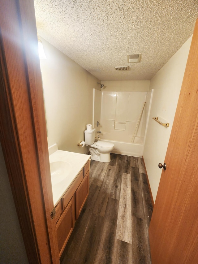 14595 Lynndale Ln, Baxter, MN 56425 - full bathroom featuring a textured ceiling, visible vents, wood finished floors, and vanity