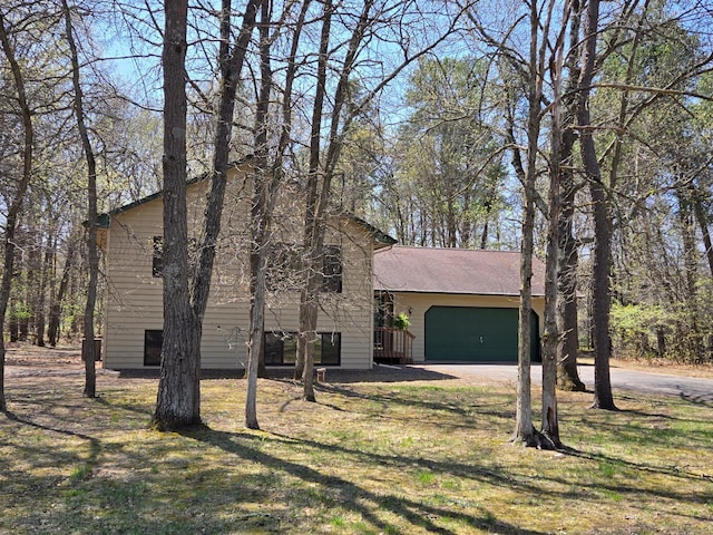 14595 Lynndale Ln, Baxter, MN 56425 - view of front of property featuring an attached garage, driveway, and a front yard