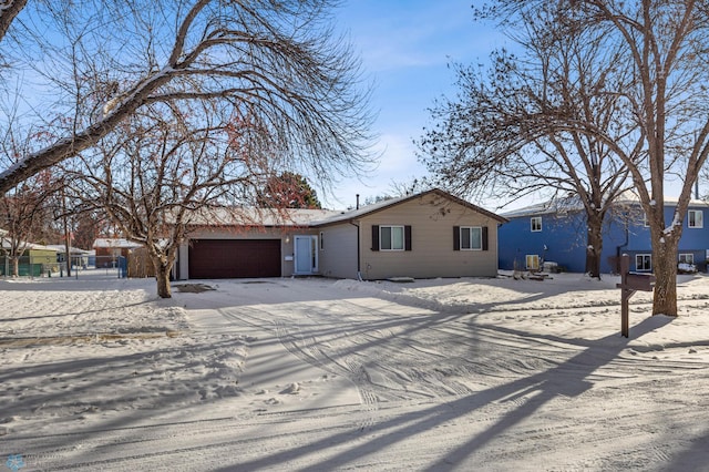 ranch-style home featuring an attached garage