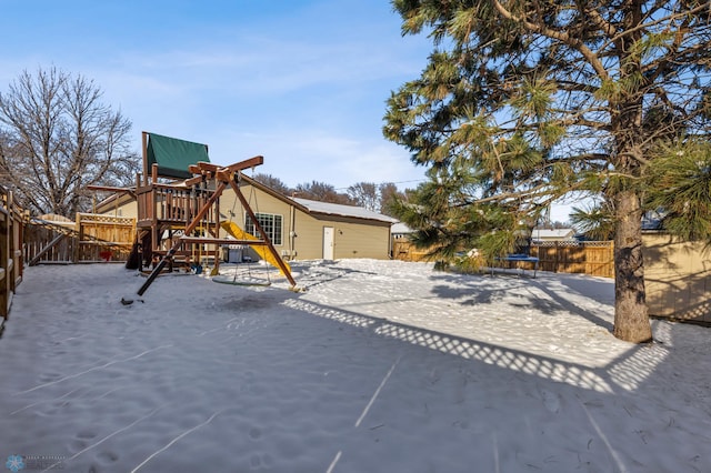 exterior space featuring a fenced backyard and a playground
