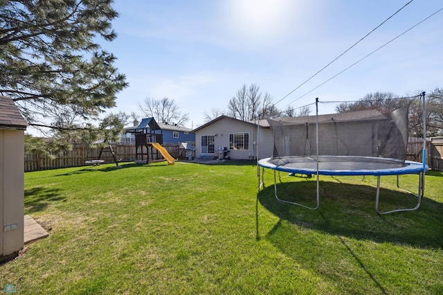 1922 18th St S, Fargo, ND 58103 - view of yard featuring a trampoline and a playground