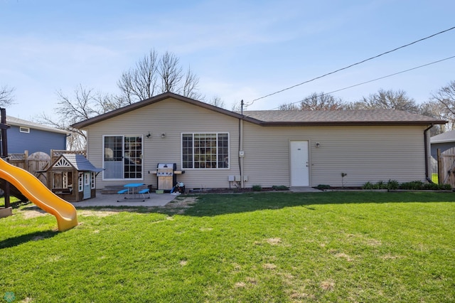 1922 18th St S, Fargo, ND 58103 - back of house featuring a patio, a playground, and a yard