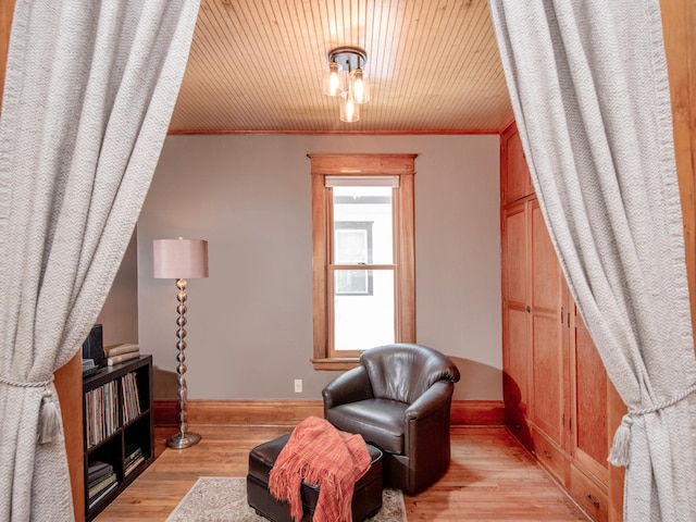 115 Geranium Ave W, Saint Paul, MN 55117 - sitting room with light wood-type flooring and ornamental molding