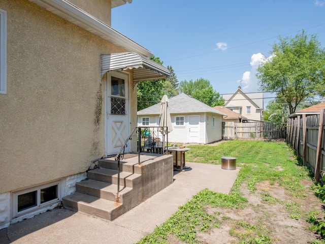 115 Geranium Ave W, Saint Paul, MN 55117 - fenced backyard featuring an outbuilding