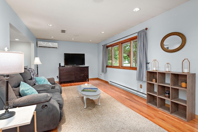 113 Oak Ave SW, Saint Michael, MN 55376 - living room featuring a baseboard radiator, an AC wall unit, wood finished floors, and recessed lighting