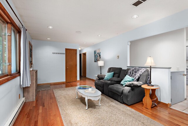 113 Oak Ave SW, Saint Michael, MN 55376 - living room featuring baseboard heating, light wood finished floors, and recessed lighting
