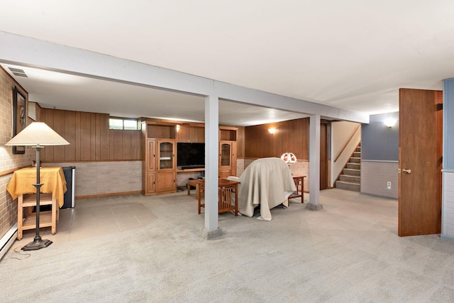 113 Oak Ave SW, Saint Michael, MN 55376 - basement featuring wooden walls, light colored carpet, brick wall, and stairway