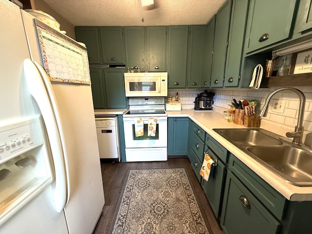 328 Jefferson Pl, Faribault, MN 55021 - kitchen featuring green cabinets, white appliances, light countertops, a sink, and a textured ceiling