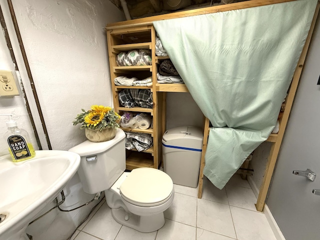 328 Jefferson Pl, Faribault, MN 55021 - bathroom featuring a sink, tile patterned flooring, and toilet
