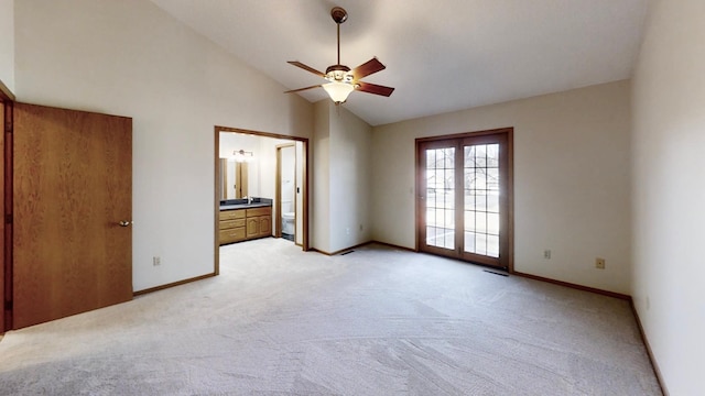 unfurnished bedroom featuring access to outside, ensuite bathroom, baseboards, light colored carpet, and ceiling fan