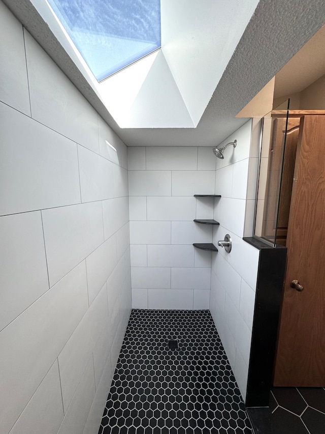 bathroom with tiled shower