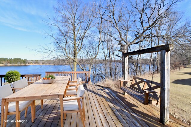 4755 384th St, Brockway Twp, MN 56377 - wooden deck featuring outdoor dining space and a water view