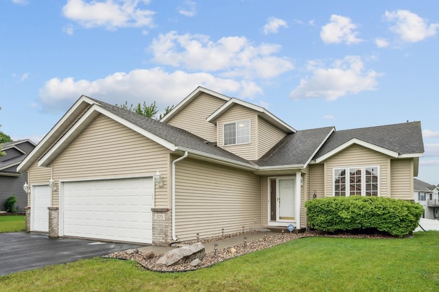 579 Maple Knoll Cir NW, Saint Michael, MN 55376 - traditional home featuring a garage, asphalt driveway, a front yard, and roof with shingles