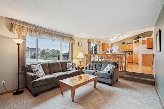 579 Maple Knoll Cir NW, Saint Michael, MN 55376 - living room featuring light colored carpet, a textured ceiling, ceiling fan, and lofted ceiling