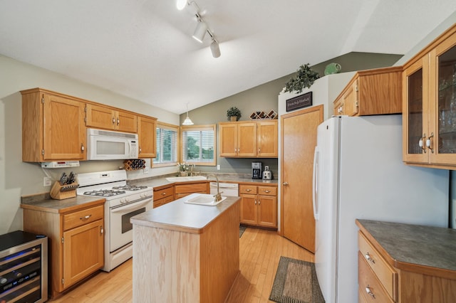 579 Maple Knoll Cir NW, Saint Michael, MN 55376 - kitchen with white appliances, beverage cooler, vaulted ceiling, an island with sink, and light wood-style flooring
