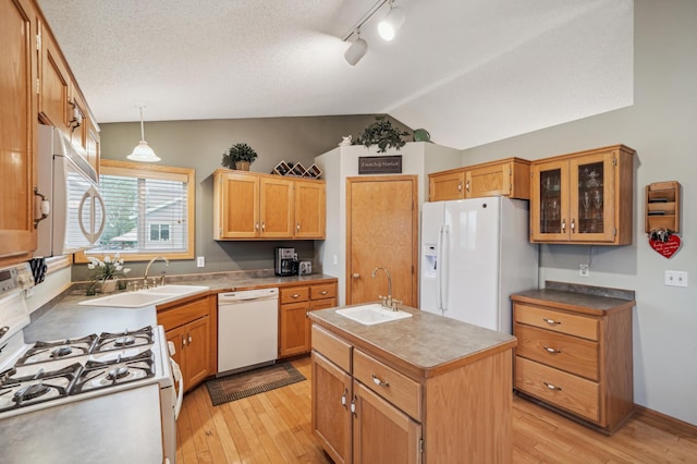 579 Maple Knoll Cir NW, Saint Michael, MN 55376 - kitchen with white appliances, lofted ceiling, light wood-style flooring, a kitchen island with sink, and glass insert cabinets