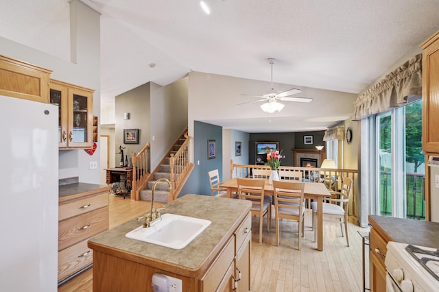579 Maple Knoll Cir NW, Saint Michael, MN 55376 - kitchen featuring white appliances, lofted ceiling, light wood-style floors, ceiling fan, and glass insert cabinets