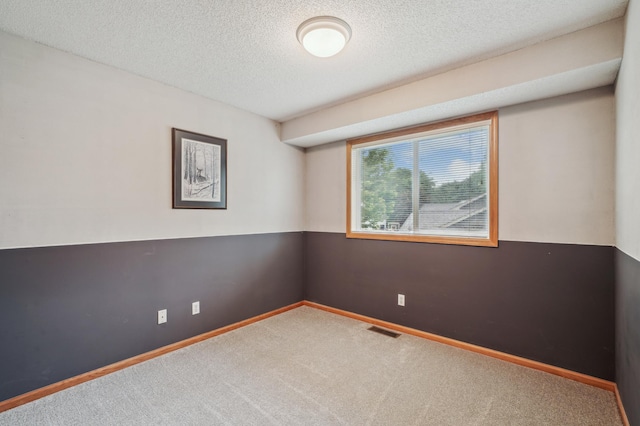 579 Maple Knoll Cir NW, Saint Michael, MN 55376 - carpeted spare room with a textured ceiling and baseboards