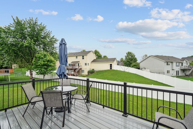 579 Maple Knoll Cir NW, Saint Michael, MN 55376 - wooden deck featuring outdoor dining area, a residential view, and a fenced backyard