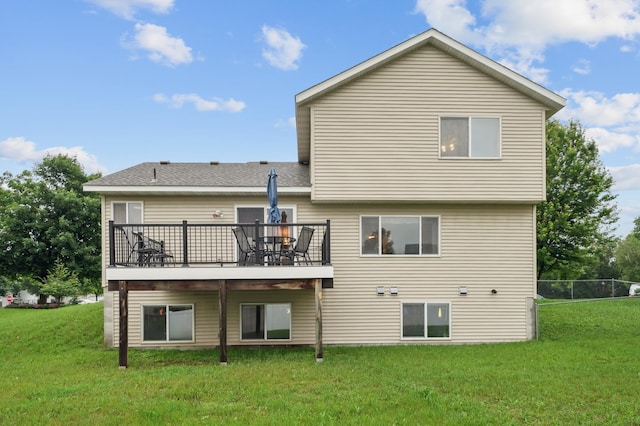 579 Maple Knoll Cir NW, Saint Michael, MN 55376 - rear view of house featuring a yard, a wooden deck, and roof with shingles