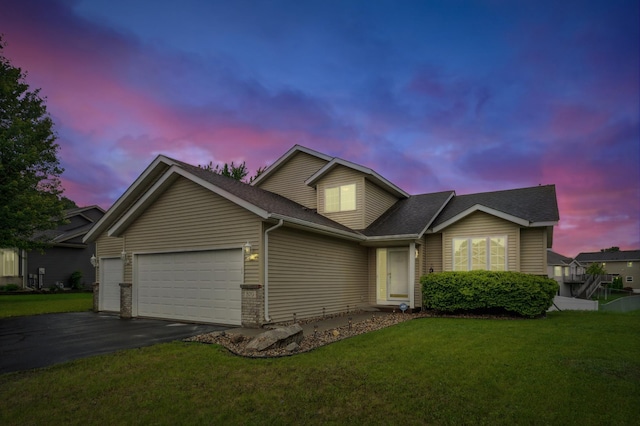 579 Maple Knoll Cir NW, Saint Michael, MN 55376 - traditional home featuring a garage, driveway, a lawn, and roof with shingles
