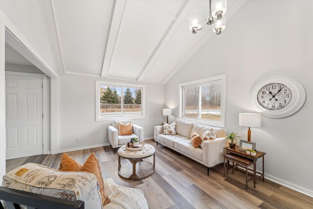 12005 Stacy Trl, Lindstrom, MN 55013 - living room featuring vaulted ceiling with beams, baseboards, and wood finished floors