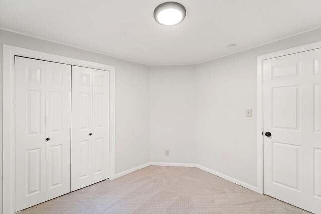 12005 Stacy Trl, Lindstrom, MN 55013 - unfurnished bedroom featuring light carpet, baseboards, and a closet